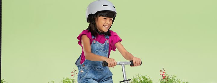 Girl riding her scooter