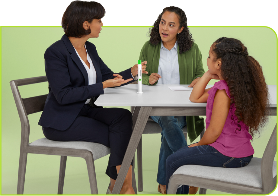 Nurse at table with family discussing SKYTROFA