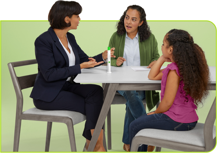 Nurse at table with family discussing SKYTROFA