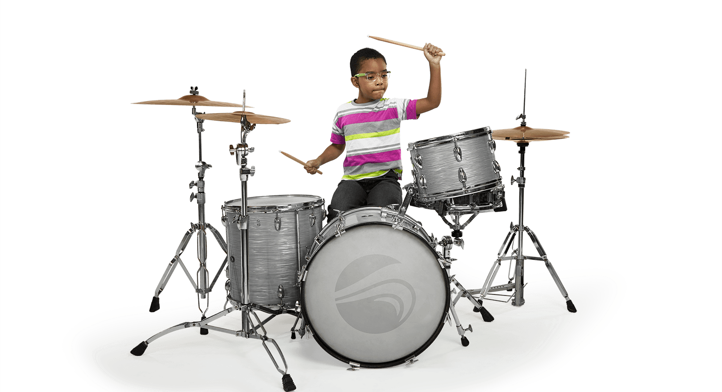 Boy playing on the drums.